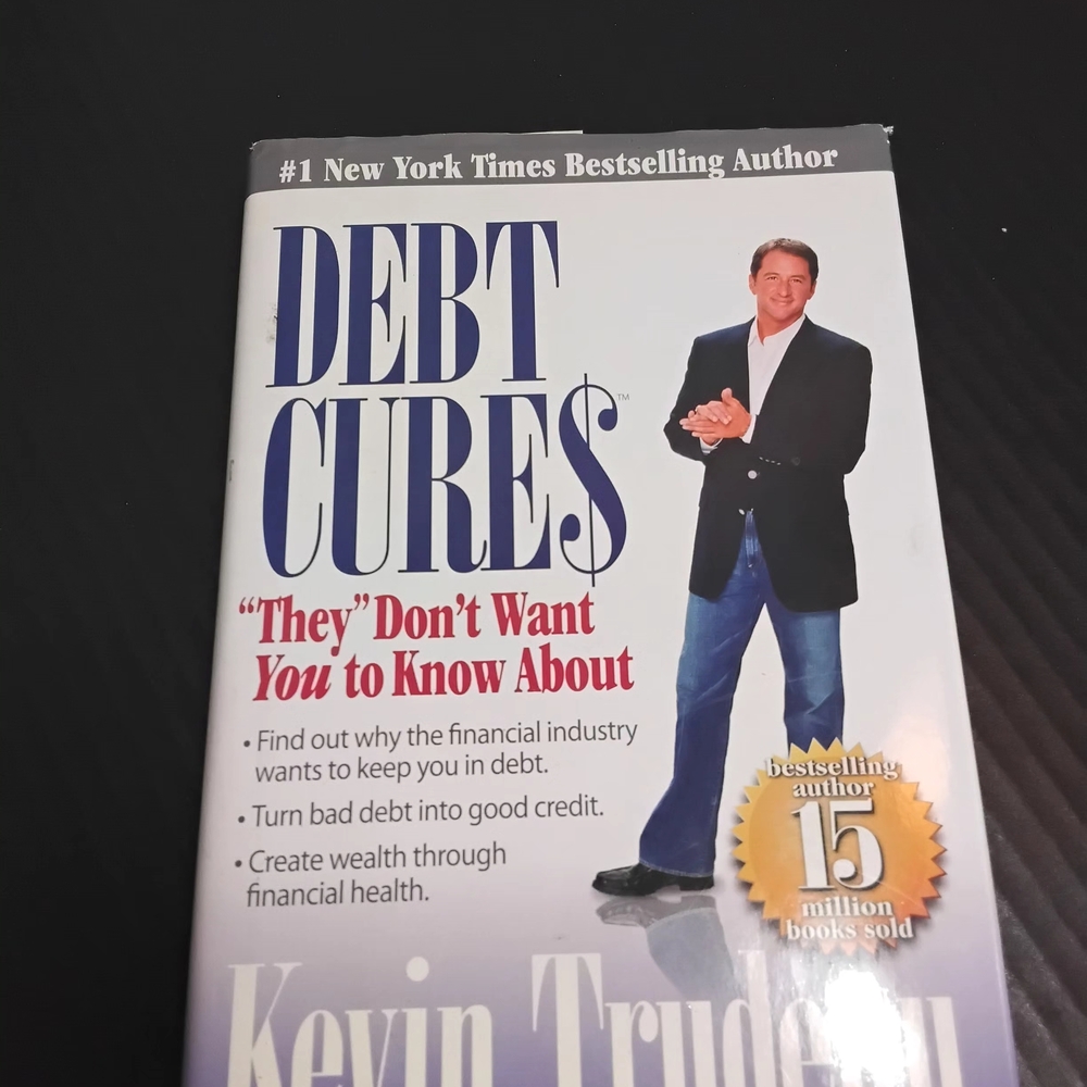 Debt Cures Book by - White and Black Cover